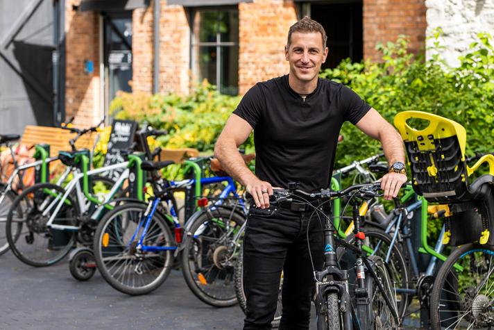 Kristjan Lind holding a bike