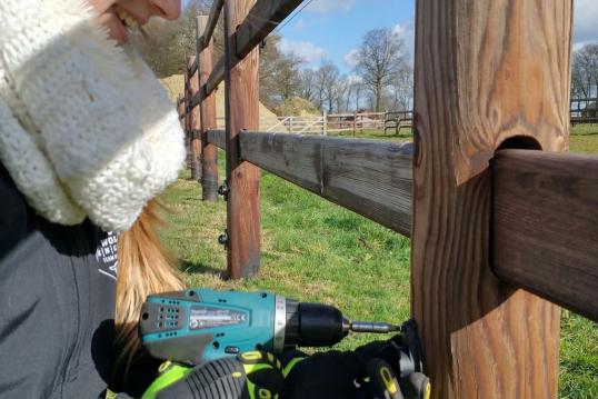 Team fixing the fence