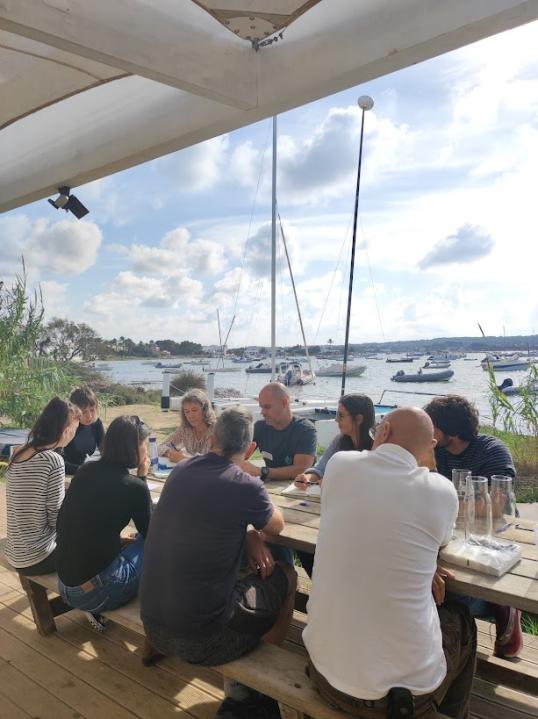 Capacity group meeting in a terrace under the sun